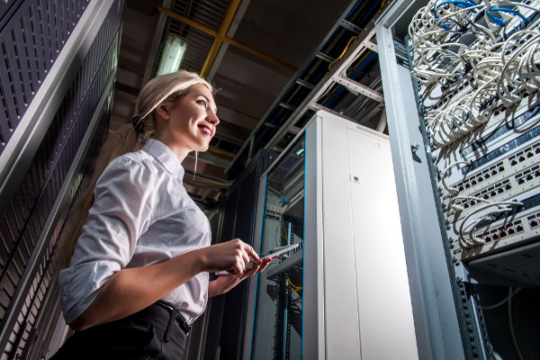 Smiling woman checking network infrastructure